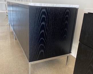 We have 2 of these to sell! "Florence Knoll Credenza" - 4
Position. DWR List Price $15,827.00
Top: Satin Marble - color Carrara. Body: Ebonized Oak
Base: Polished Chrome . Manufactured by Knoll.
Body: Ebonized Oak
Vase: Polished Chrome DWR List Price $15,946.00
