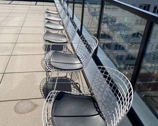 Bertoia Indoor-Outdoor Side Chair, manufactured by Knoll. We have 6 of these to sell that have been outside.  DWR retail price: $930.00. 
Configuration: Side Chair
Style: With seat Pad
Frame: White
Base Finish: White
Upholstery: Vinyl - Color Black