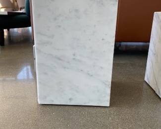 Plinth Side Tables designed by Norm Architects. Material: White carrara marble - We have 1 that is short and 1 that is tall.  2 to sell total. Both list at retail for $1,625.00. 
