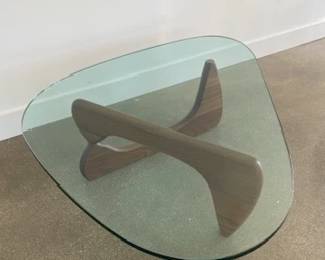 Noguchi Coffee Table designed by Isamu Noguchi. Glass and walnut. DWR retail price $2,295.00. 