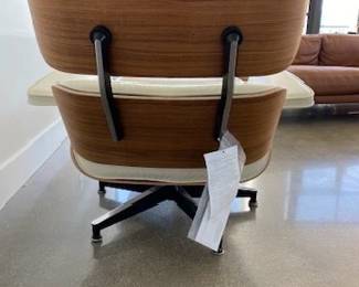 Tags still on! "Eames Leather Lounge Chair and Ottoman" Designers: Charles and Ray Eames. DWR  List Price: $11,710.00. 
Materials: Walnut wood with Ivory leather. 