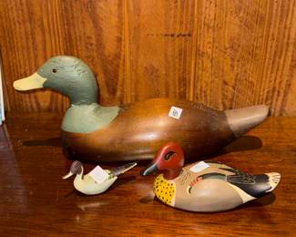 A collectible Mason Decoy Factory wooden duck decoy.
