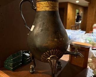 A 19th-century Dutch or German black painted toleware samovar with gilt decoration.