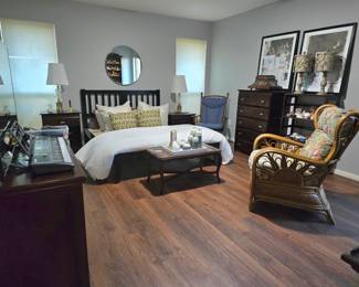 Bedroom set includes 2 nightstands, headboard with wrap-around bedframe, plus dresser.  Also shown is a fabulous, eye-catching rattan chair, pair of antique brass & crystal lamps, contemporary lamps, bedding, accent pillows, antique coffee table, glider rocker, and lots of decor! 