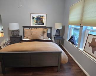 Queen bed with headboard, footboard, mattress, bed frame, lamps, nightstands, wall art and lots of decorative pillows