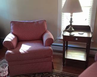 Upholstered chair with side table and lamp