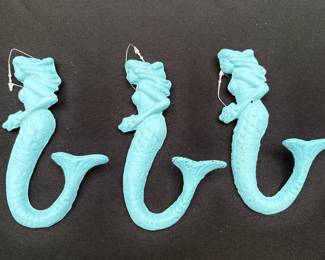Cast iron mermaids