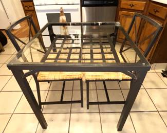 Glass top table with two chairs. 29" x 29" x 30"