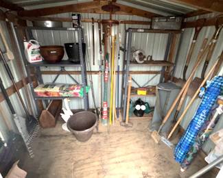 Variety garden tools, metal shelves.
