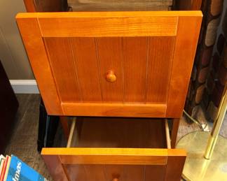 Two drawer wood file cabinet.