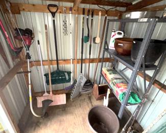 Variety garden tools, metal shelves.
