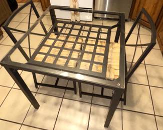 Glass top table with two chairs. 29" x 29" x 30"