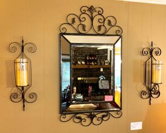 Mirror and sconces.