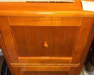 Two drawer wood file cabinet.