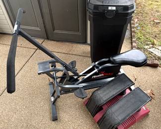 Exercise equipment. Plastic trash can.