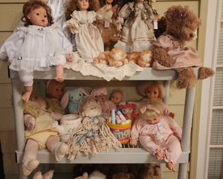 Beautiful porcelain and plush dolls elephants bears and more