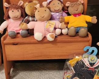 Arthur show
characters shown are Arthur the aardvark (far right, yellow sweater), his sister D.W. (far left, pink dress), Buster the rabbit (center, pink outfit), and presumably Buster's mother (second from left, plaid shirt) and Francine (second from right, purple dress).