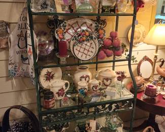 A super nice very high quality wrought iron and glass Bakers rack with decorative grapes and leaves