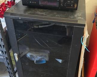 AV Rack with Denon and Harman Kardon receivers.