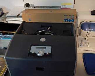 Large industrial photocopier with toner.