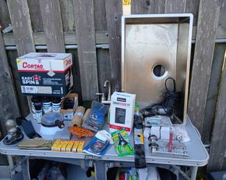 TONS OF TOOLS  AND SUPPLIES!! im not naming them all but handtools, eletric tools, looks like a small home depot lol 