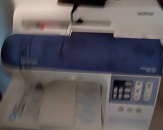 Brother sewing machine and another. Sorry, picture is blurry.