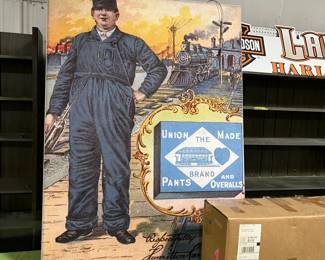 Double sided Carhartt light up hanging store display sign. Fabric photos on two sides. Other side has a female in work clothing