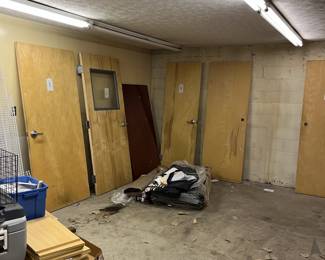 Assorted solid wood doors with metal framing