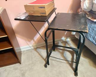 Vintage industrial metal typewriter table with drop-leaf sides.