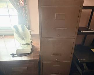 There are two tall file cabinets in the home.