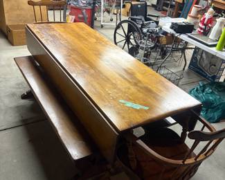 Beautiful leaf table with two benches and two chairs.
