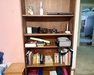 Multiple bookcases through the home that are for sale.