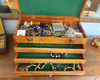 Costume jewelry in a beautiful jewelry box.