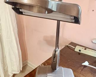 The homeowner was a stamp collector and used this illuminating magnifying lamp.