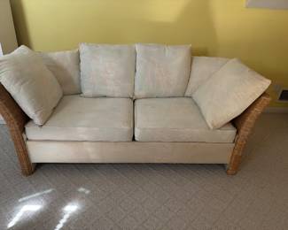 Rattan sleeper sofa.  Heavy, please bring assistance to help move