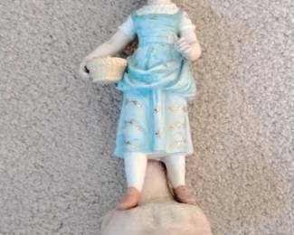 Porcelain Figurine of a Young Girl with Basket