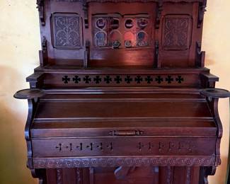 Ornate intricately carved pump organ manufactured by Cornish and Company, Washington, New Jersey, 1879-1921, known for high quality workmanship. Having a beautifully maintained exterior, the organ is not currently playable