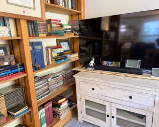 Flat Screen Tv, Tv Stand with glass front cabinet doors, clocks