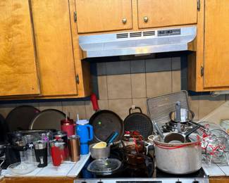 Pizza Pans, Cast Iron Skillet, Can Opener, Toaster, Silverware, Baking Sheet, Pots with matching lids set. 