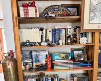 Vintage fire extinguisher, Bugs Bunny, Gulf, handmade wooden vase, Uncle Sam bank, monkeys, ducks, wide assortment of hard back books, dvds, cassettes, and paperbacks.