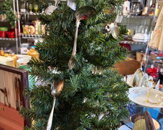 WE have lots of trees of all sizes for sale.  This one is decorated with old spoons for the kitchen.