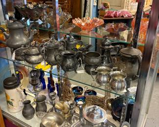 Pewter coffee and tea sets, cream and sugar sets, candle holders, trays, vases, bowls