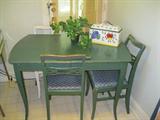 TABLE AND 4 CHAIRS....ONE CHAIR IS WHITE.....