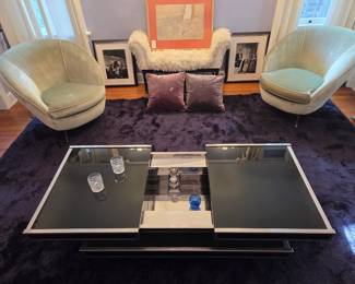 Cool Mid-Century Hidden Bar Cocktail Coffee Table by Willy Rizzo for Cidue (it slides open and closes to reveal storage for glasses and bottles); Pair of Velvet Tub Chairs, possibly by Ico and Luisa Parisi; "Lama Fur" Bench possibly by Francis Sultana; Cool Modern Floor Lamp on a Black / Aubergine Soft Shag Rug