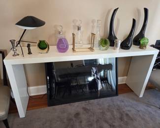Pair of Billy Haines-Style Low Chairs; White Console Table; Cool small black Tripod Desk Lamp; Two Italian Glass Vases; three Art Glass Vases; Crystal Decanters; Italian Art Glass Vases