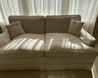 Cream colored loveseat w/down cushions