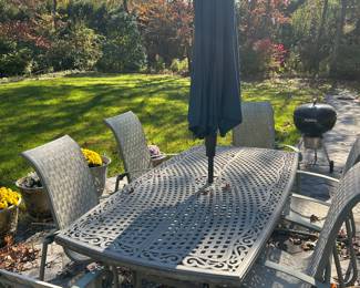 Outdoor table/ umbrella and umbrella stand/ Weber charcoal grill