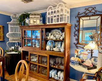 Packed full stacking glass cases with sliding doors with stemware, milk glass, more blue and white.