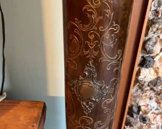 Ornate decoration on two sides and around the top