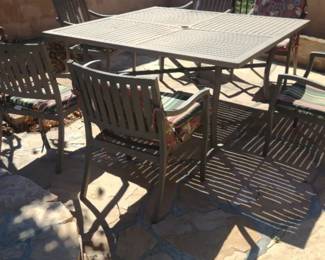 outdoor dining set with a slatted table and chairs